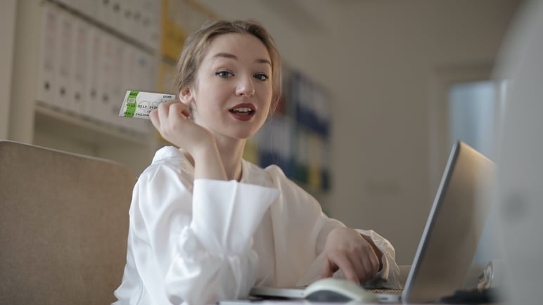 Female holding Plastk Secured Credit Card