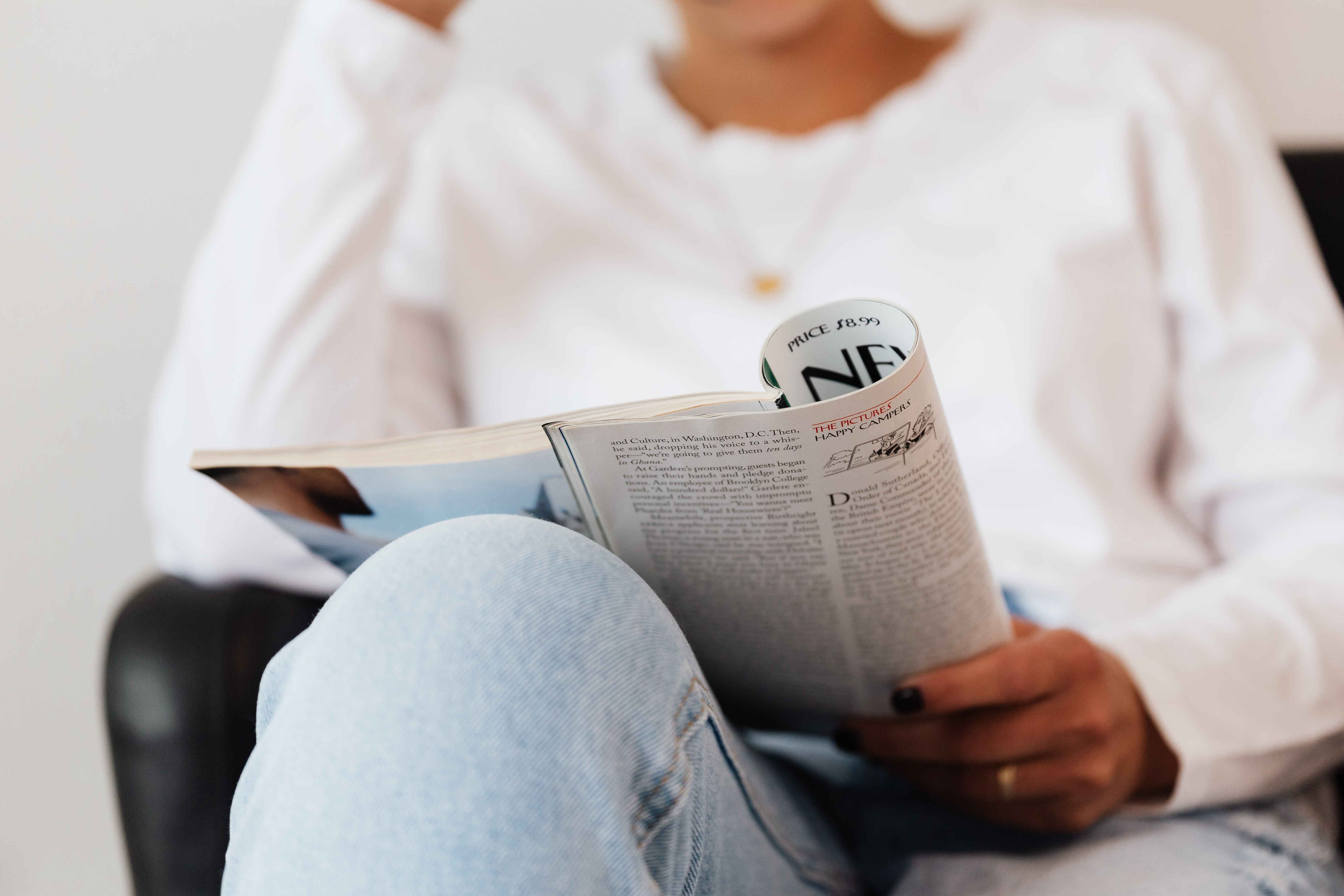 Woman reading newspaper